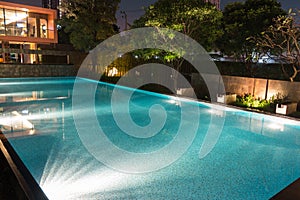 Peaceful pool reflections in the evening twilight with warm still water filled to the brim and ready for swimming. Bright mood l photo