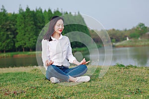 Peaceful quite happy life, Asian Chinese yoga woman girl beauty by lake river sea ocean