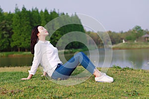 Peaceful quite happy life, Asian Chinese yoga woman girl beauty by lake river sea ocean