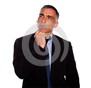 Peaceful and reflective man touching the chin