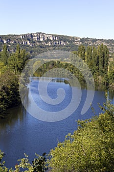 The peaceful River Lot flowing through rural countryside