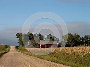 Peaceful Rural road and red barn