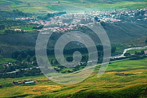 Peaceful rural village with green valley river in the morning cooking smog