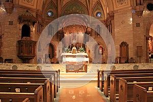 Peaceful scene with empty pews in front of alter, Holy Ghost Catholic Church,downtown Denver,2015