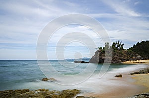 Peaceful scenery of tropical sandy beach under bright sunny day. nature compositon, noise and grain effect