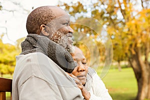 Peaceful senior couple sitting on a bench