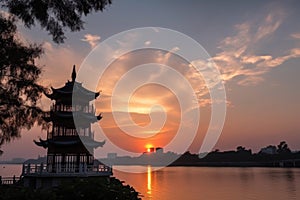 peaceful and serene sunset, with view of china pagoda against the horizon