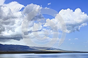 Peaceful shore with dramatic clouds, Qinghai Lake, China
