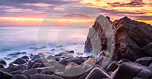 Peaceful sunrise over rocks on the Gold Coast in Australia