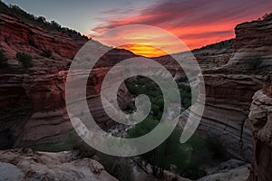 peaceful sunset, with the fiery canyon walls providing a dramatic backdrop