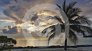 Peaceful sunset in the Maldives. The clouds shine golden in the sun`s rays.