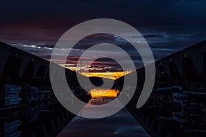 Peaceful Sunset over Sailboats at Dock