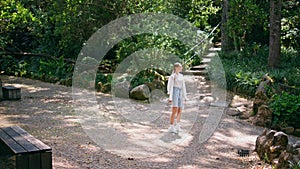 Peaceful tourist enjoy green beautiful forest trees standing recreation place.