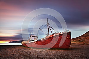 Peaceful view of the Atlantic ocean at dawn. ship wreck in the Iceland, Europe. Scenic image of beautiful nature landscape.