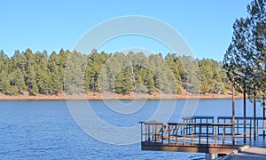Peaceful view of a deck extended over Fool Hollow Lake in Show Low, Navajo County, Apache Sitgreaves National Forest, Arizona USA
