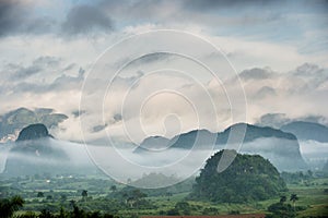 Peaceful view of Vinales valley at sunrise. Aerial View of the Vinales Valley in Cuba. Morning twilight and fog. Fog at dawn in th