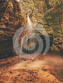 Peaceful waterfall creates a meditative mood in wilde garden