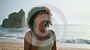 Peaceful woman meditating beach close up. girl putting hand on chest at sunrise