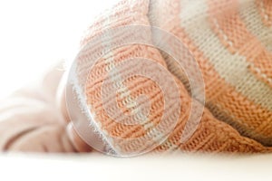 Peacefully sleeping baby with wool hat