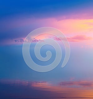 peacful sunrise pink cloudy sky over calm water Abstract Background of colorful morning sky photo