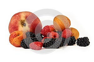 Peach, apricot, BlackBerry and raspberry isolated on white background