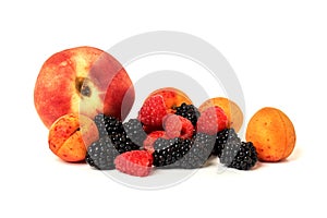 Peach, apricot, BlackBerry and raspberry isolated on white background