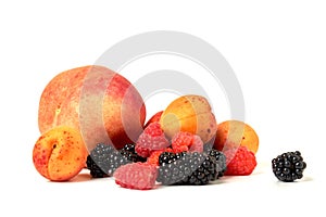 Peach, apricot, BlackBerry and raspberry isolated on white background