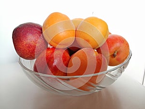 Peach and  apricot in transparen bowl