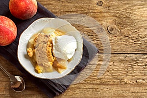 Peach cobbler with ice cream photo