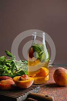 Peach cocktail in bottle on color table