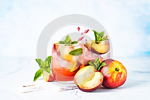 Peach cocktail, iced peach tea, fruit drink.