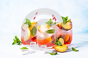 Peach cocktail, iced peach tea, fruit drink.