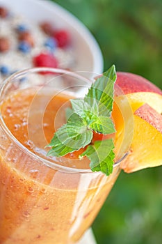 Peach cocktail with mint leaves