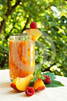 Peach coctail with raspberries