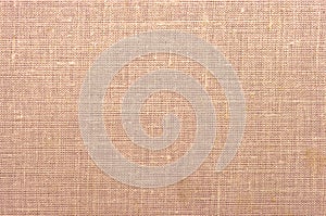 Peach-coloured fabric texture