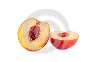 Peach cut into two halves on a white background isolated close up