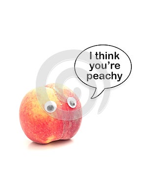 Peach with googly eyes and I Think Youre Peachy speech bubble, isolated on white