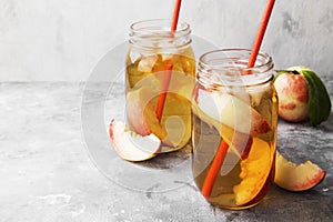 Peach ice tea on a gray background. Copy space. Food background