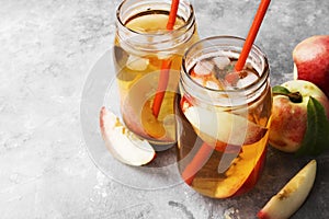 Peach ice tea on a gray background. Copy space. Food background