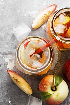 Peach ice tea on a gray background. Top view. Food background