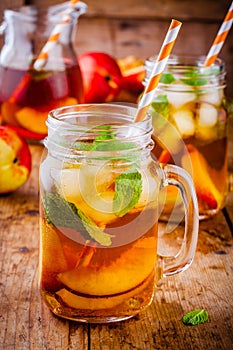 Peach ice tea in mason jar with mint