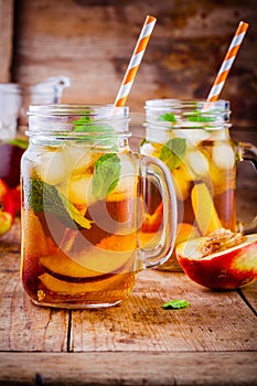 Peach ice tea in mason jar with mint