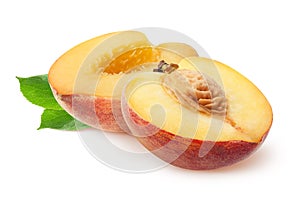 Peach isolated. Two peach half slices fruits and leaves isolated on white with clipping path.