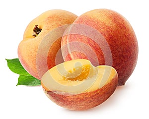 Peach isolated. Two whole peach fruits with piece and leaves isolated on white