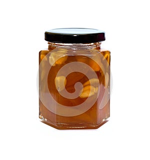 Peach jam glass jar reflected