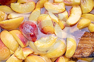 peach jam. peaches with sugar syrup. above. looking above. fruit background backdrop