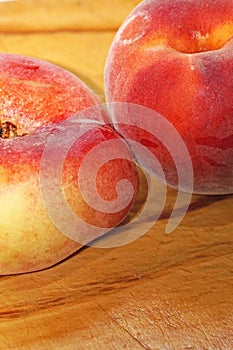 peach and paraguayan on a cutting board in the kitchen photo
