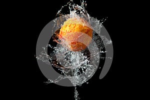 Peach in spray of water