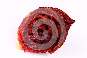 Peach stone on a white background close up