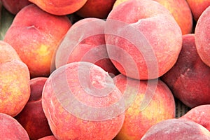 Peaches on the counter market as a background